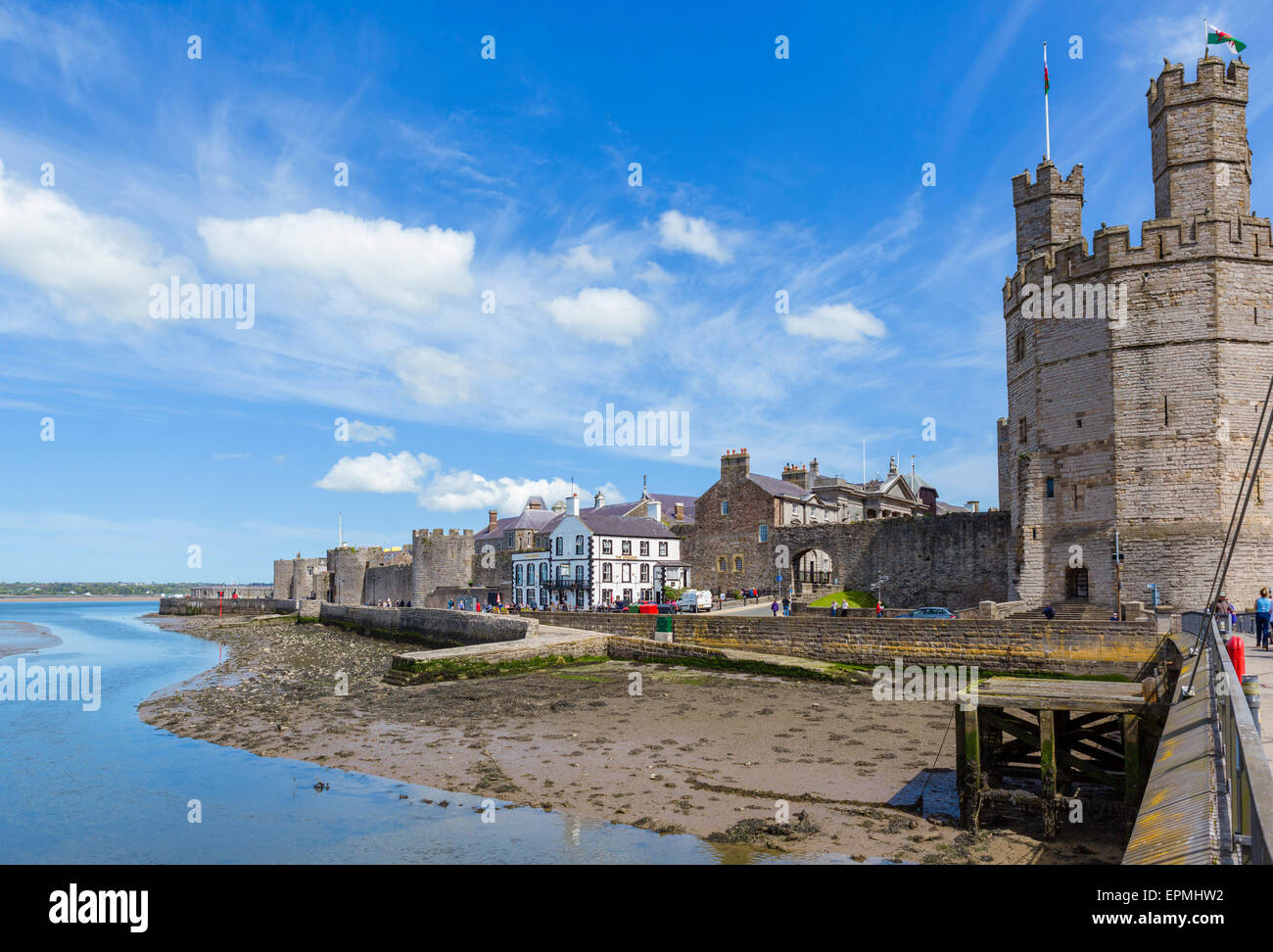 The castle and town walls from the Aber swing bridge looking towards the Menai Strait, Caernarfon, Gwynedd,  Wales, UK Stock Photo