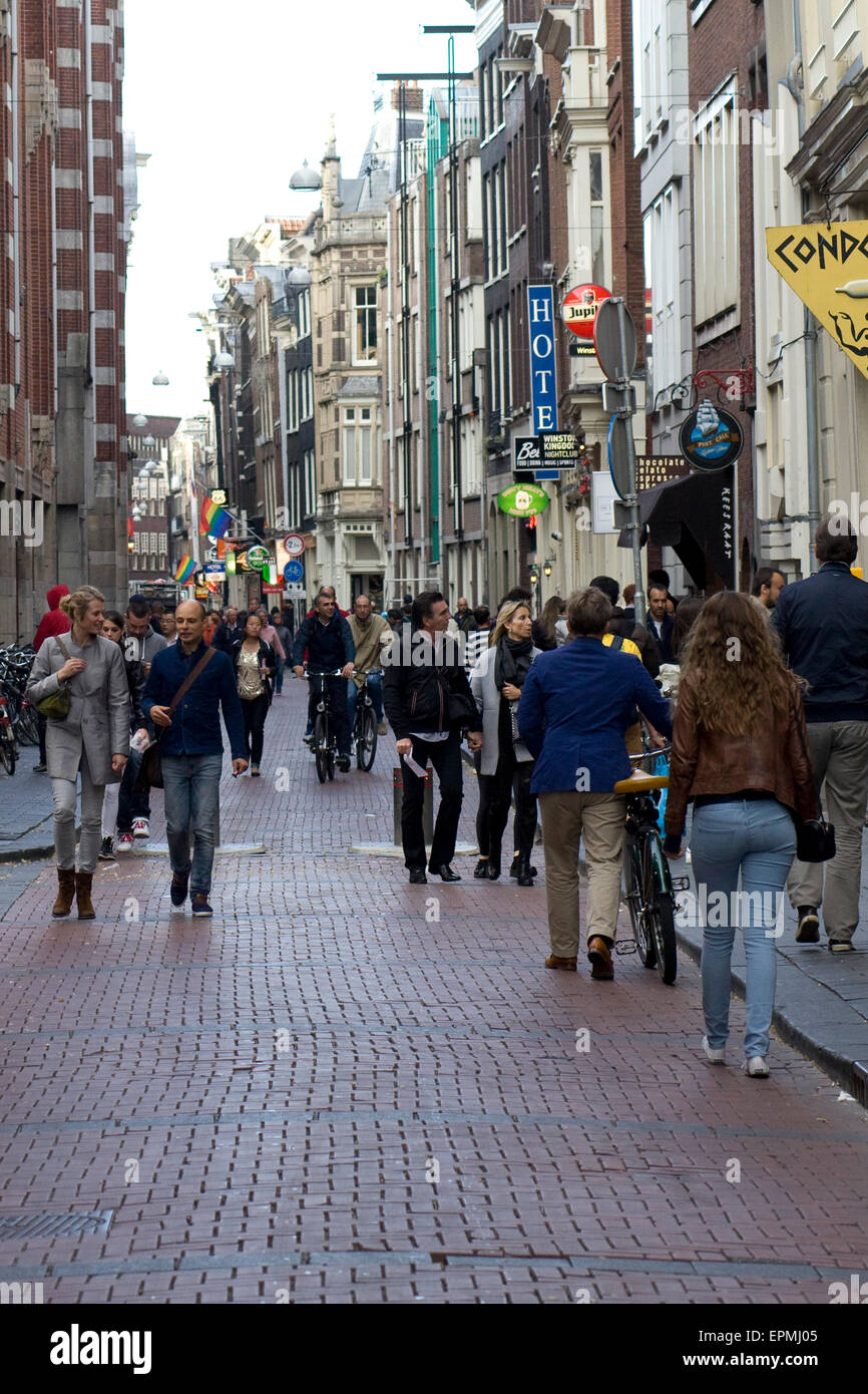 Tourists exploring the Famous Red Light District in Amsterdam Stock Photo