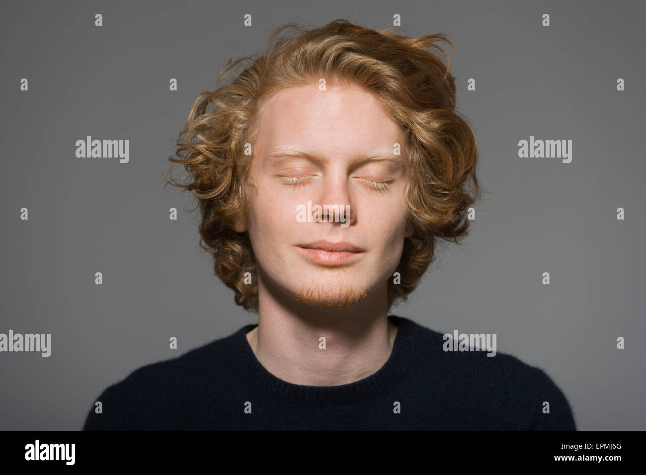 Portrait of young man with closed eyes Stock Photo