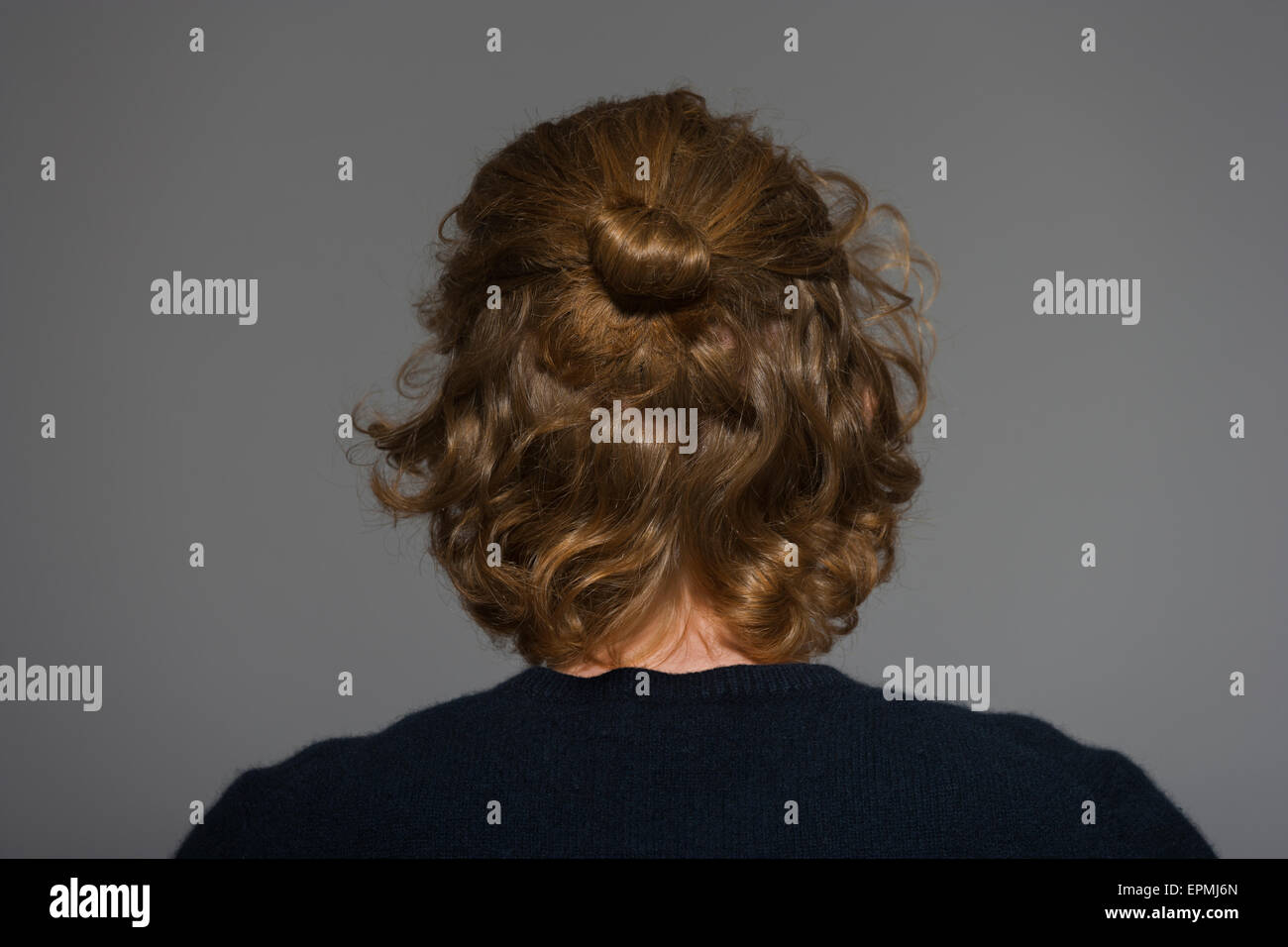 Back view of young man with bun Stock Photo
