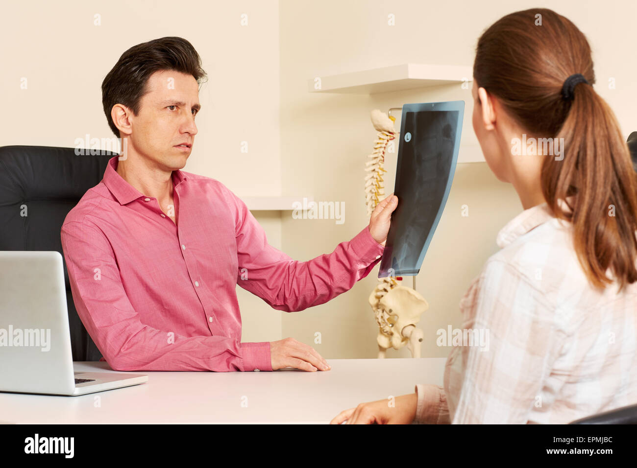 Orthopedic surgeon with a patient in treatment. Stock Photo