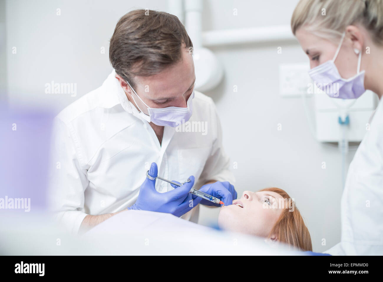 Dentist giving patient injection Stock Photo Alamy