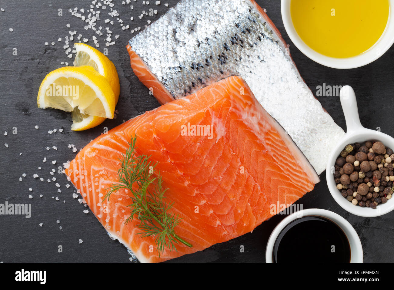 Salmon and spices on stone table. Top view Stock Photo