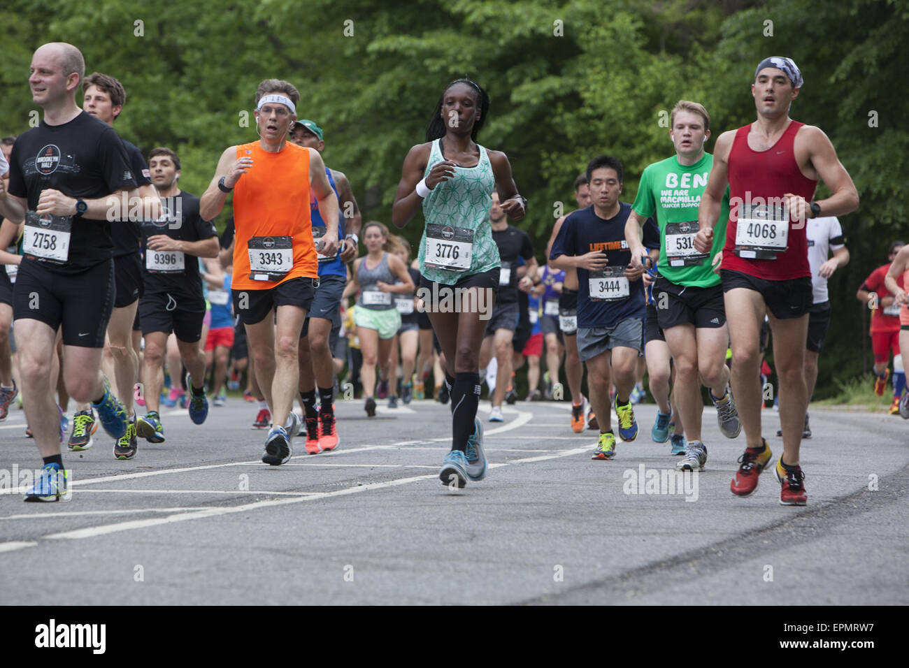 Over 25,000 runners participated in the 2015 Brooklyn ½ Marathon. Runners come to the halfway point in Prospect Park. Stock Photo