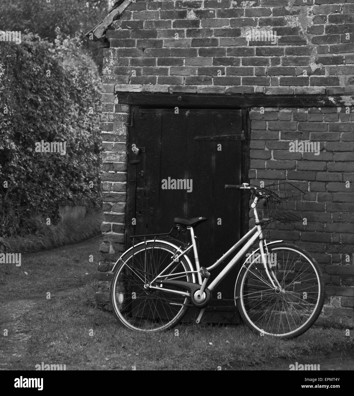 Bicycle leaning on old brick outhouse at Westleton Village Suffolk, east, anglian, daily, times, Stock Photo