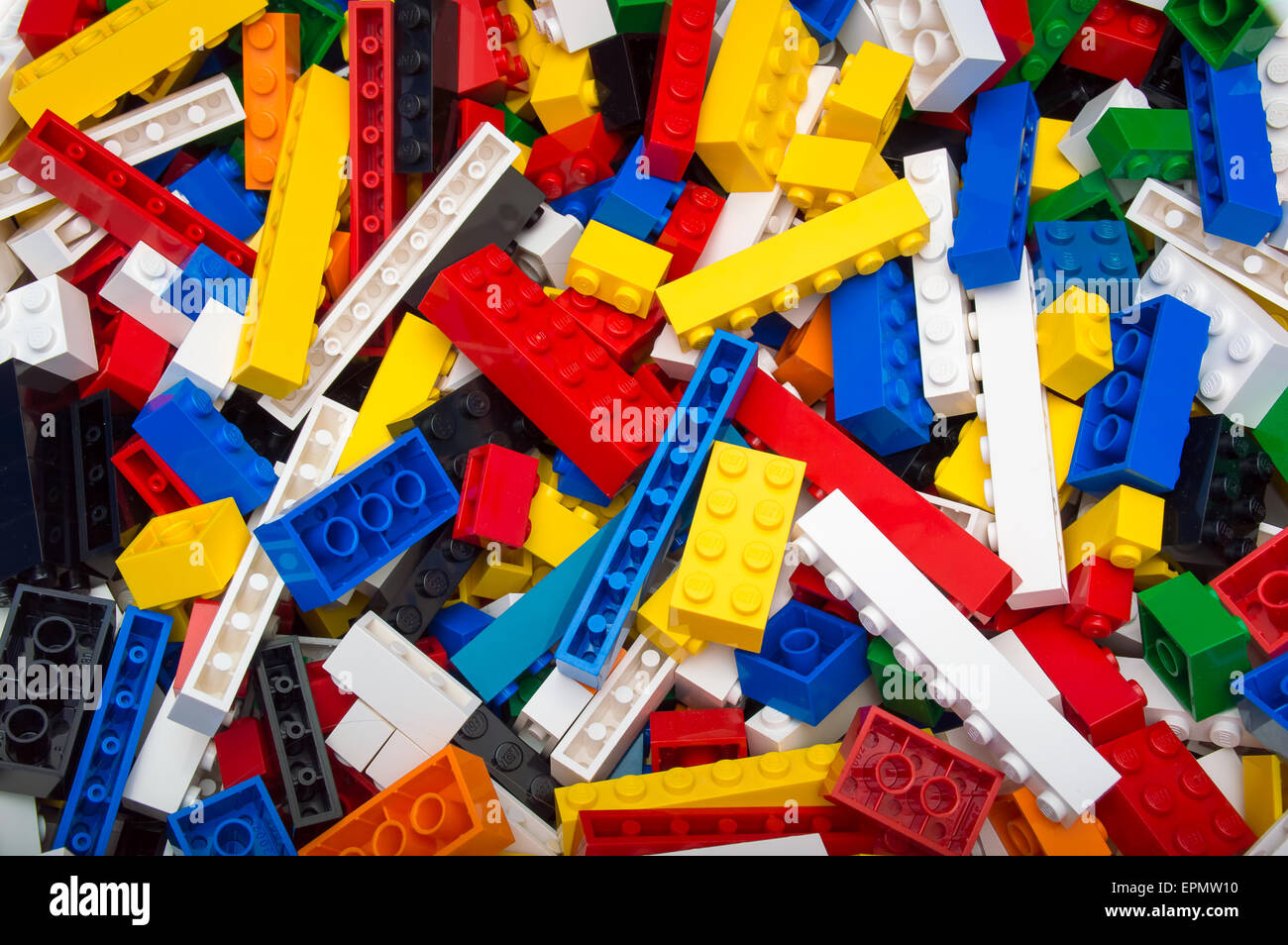 A mixture of different coloured plastic building blocks Stock Photo