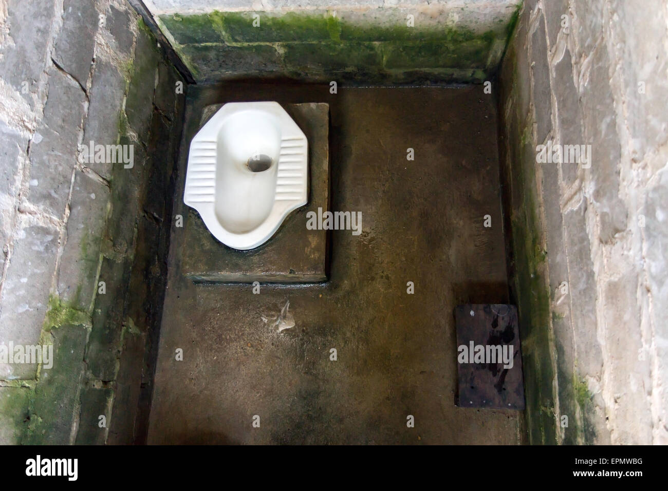 public squat type toilet at restaurant Stock Photo