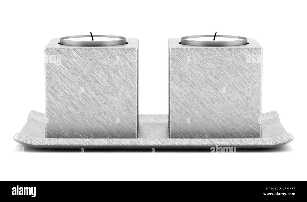 two metallic candlesticks with candles isolated on white background ...