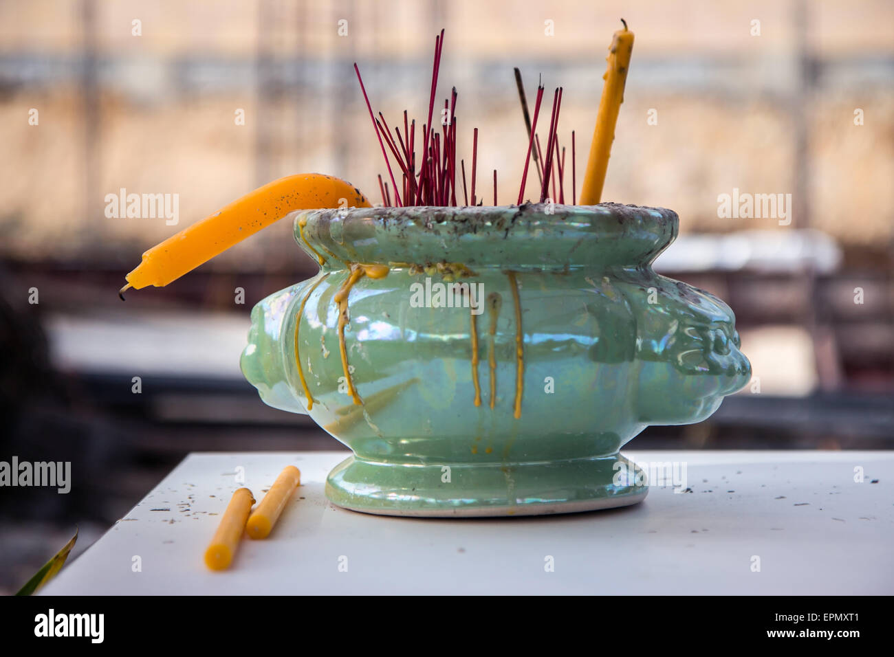 Incense sticks with candle in bowl at worship Buddha Stock Photo Alamy