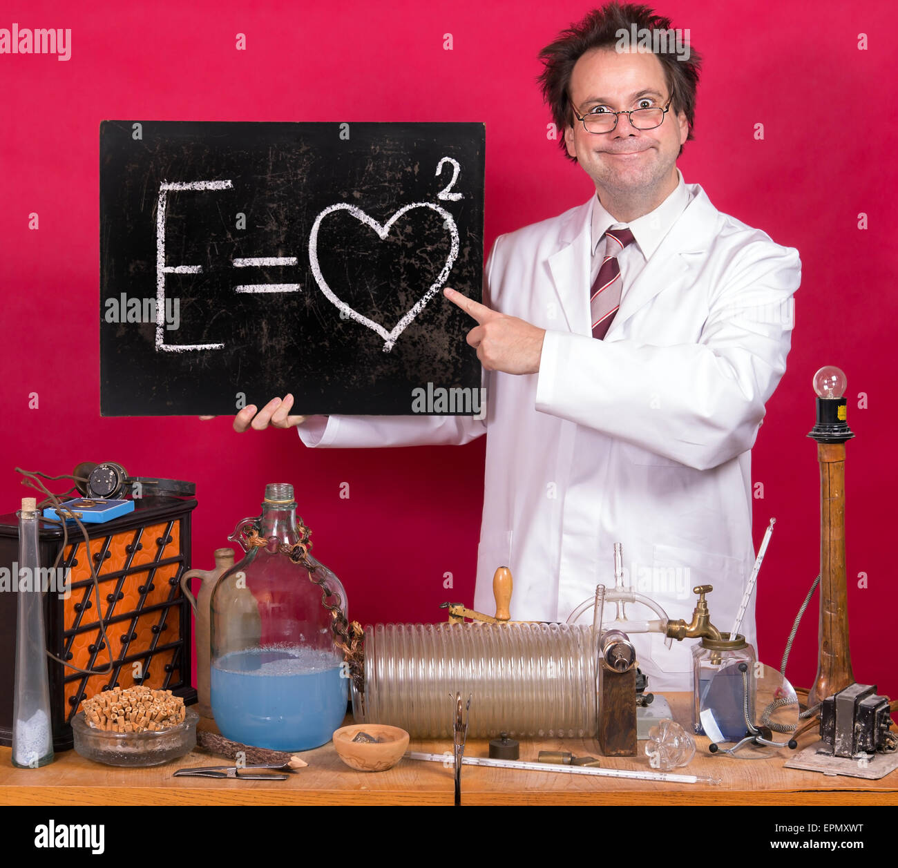 Professor in the laboratory shows a blackboard with mathematical formula Stock Photo