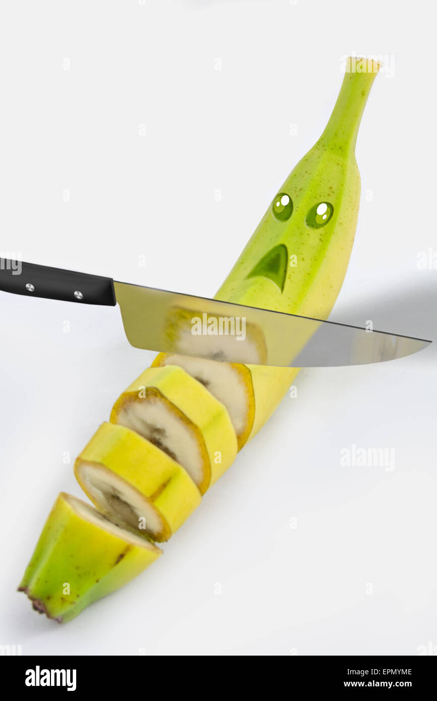 Picture of a banana that is sliced by a knife Stock Photo Alamy