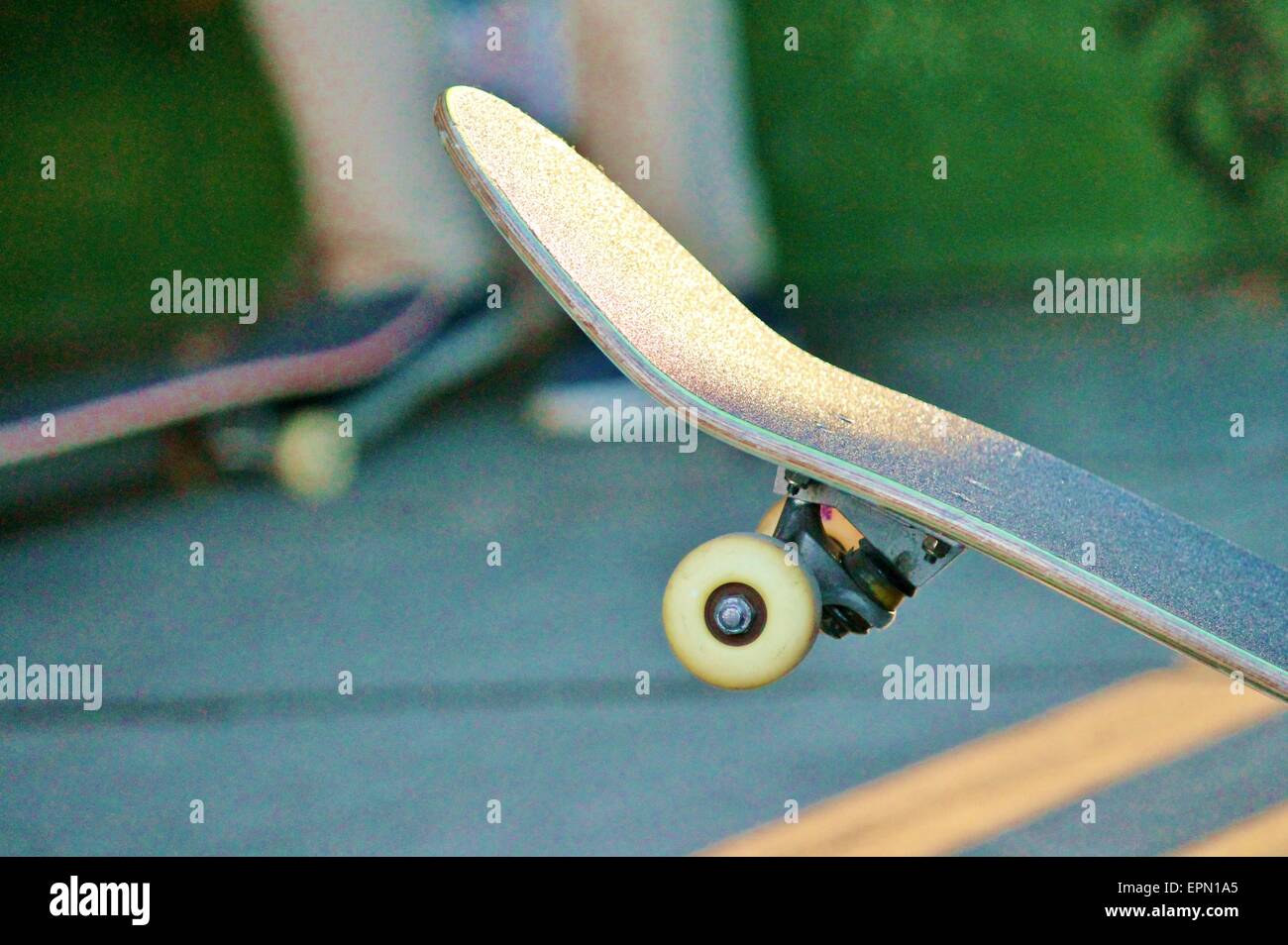 lone skateboard on concrete background with copy space Stock Photo - Alamy