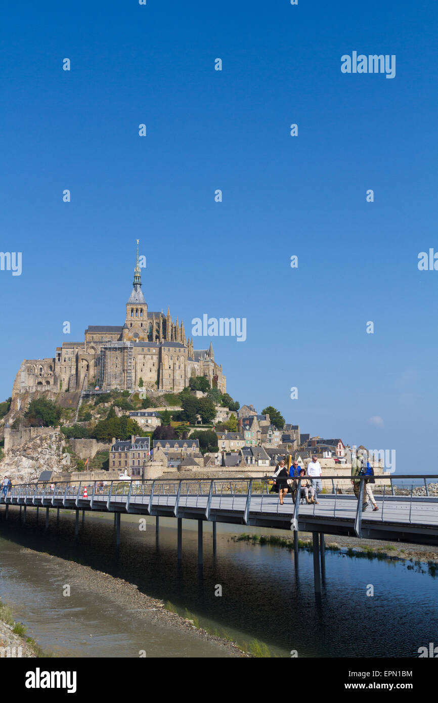 Tourists on the new bridge at Mont St Michel Stock Photo