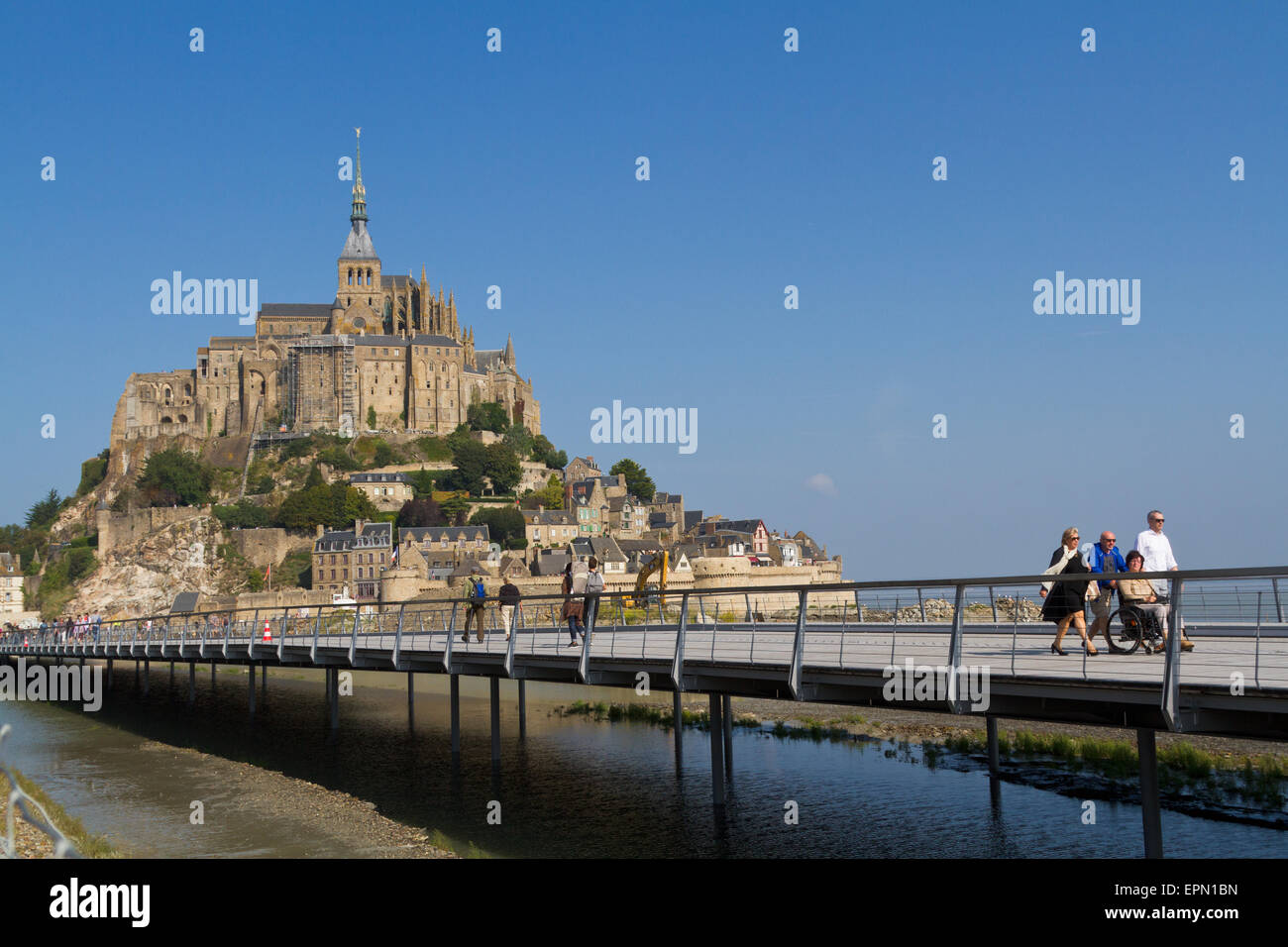 Tourists on the new bridge at Mont St Michel Stock Photo