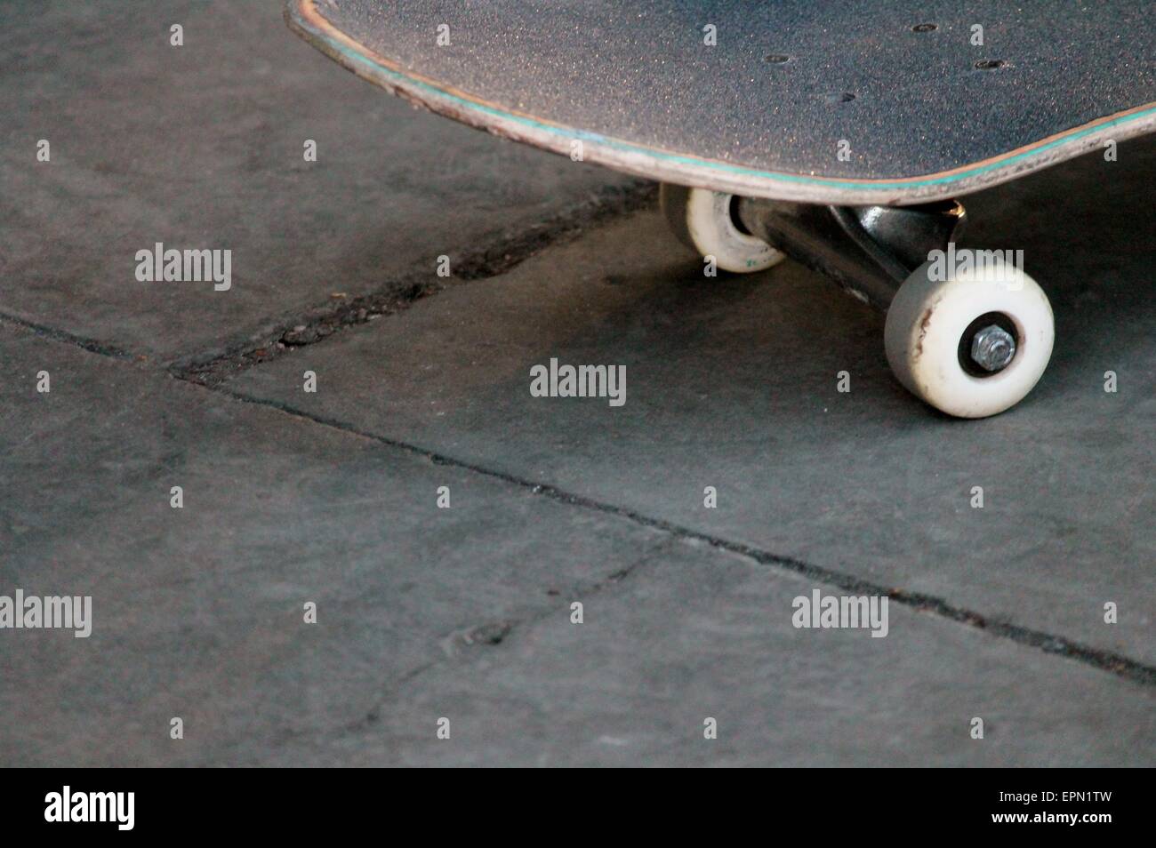 lone skateboard on concrete background with copy space Stock Photo - Alamy