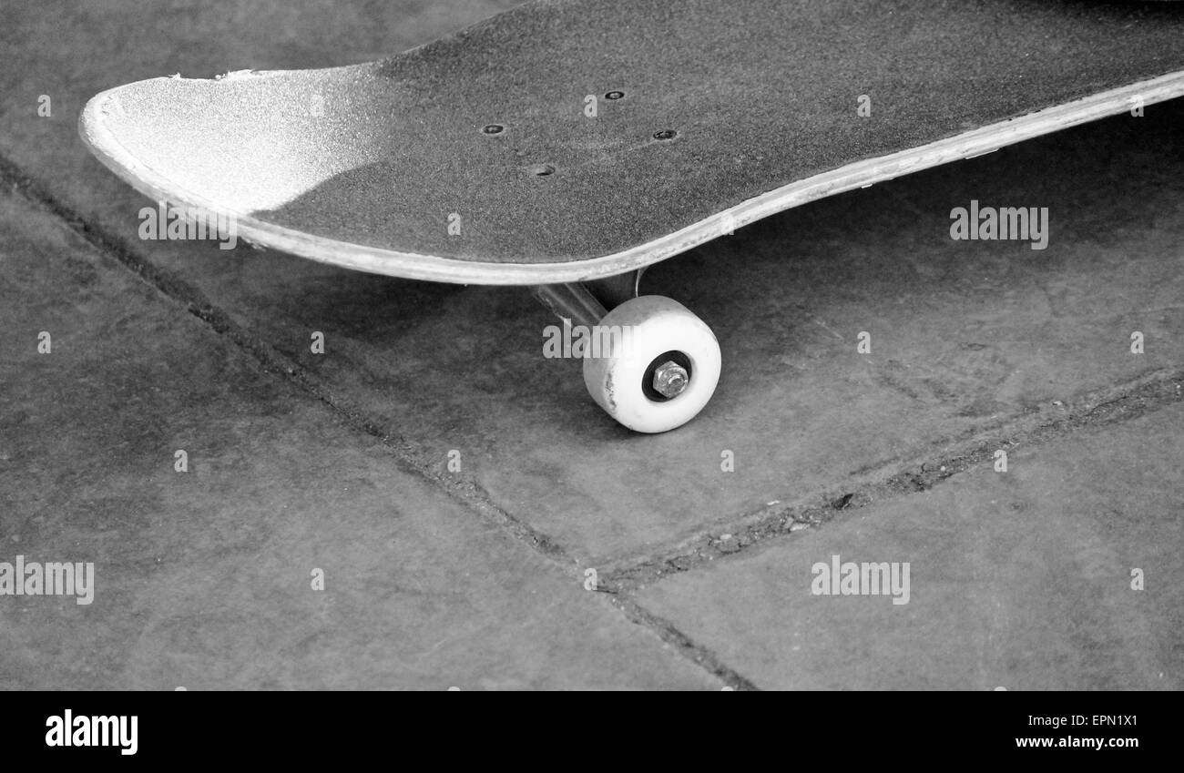 lone skateboard on concrete background with copy space Stock Photo - Alamy