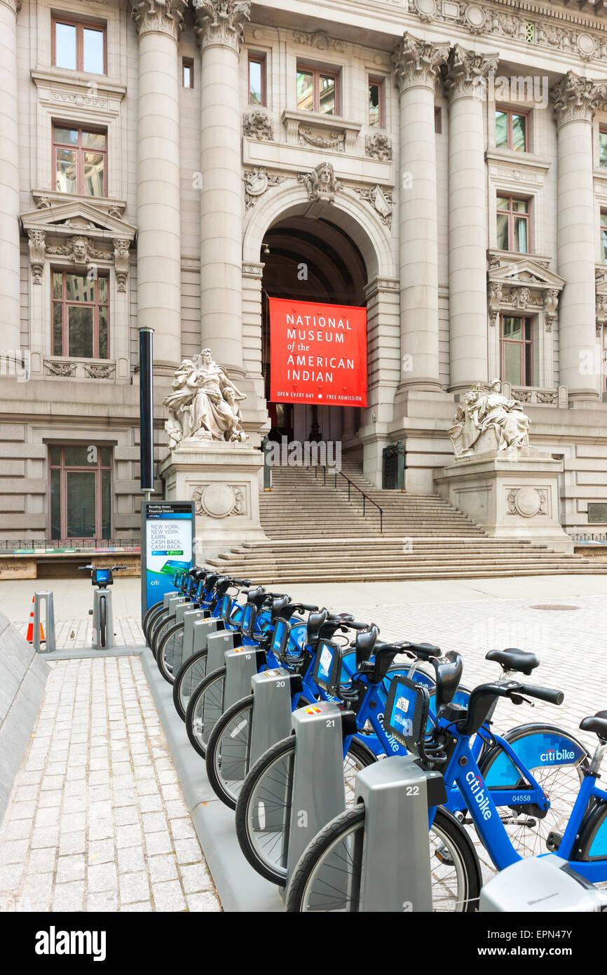 Citi Bike bicycles wait for riders at a docking station near the National Museum of the American Indian in New York City. Stock Photo
