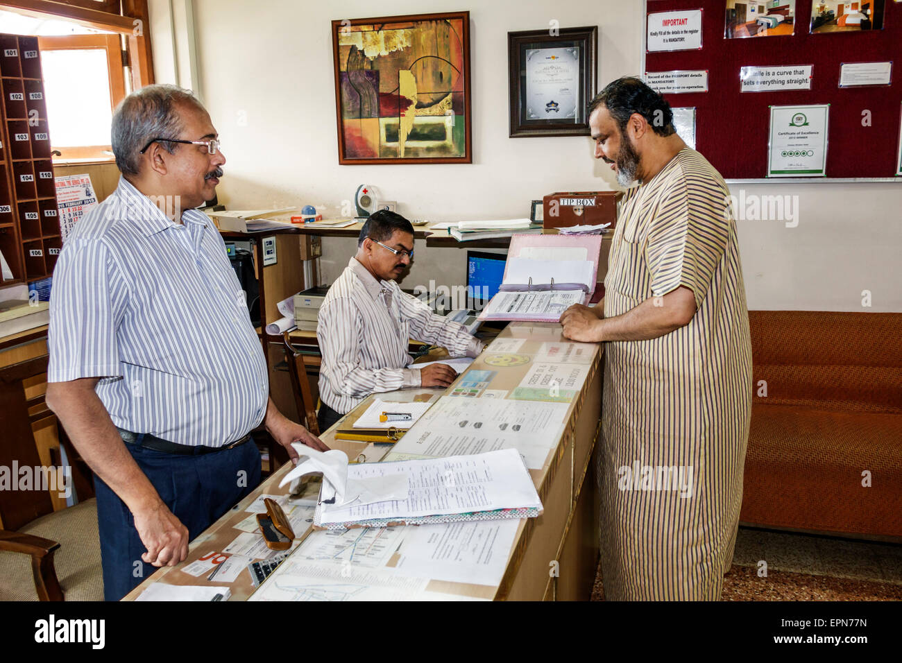 Asian male reception desk hires stock photography and images Alamy