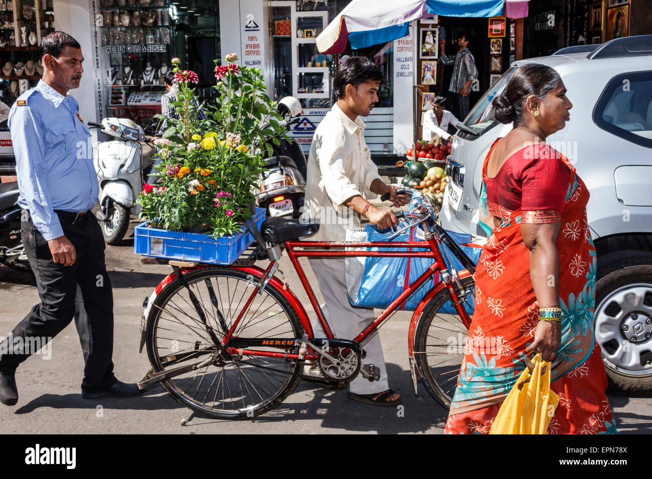 Mumbai India,Apollo Bandar,Colaba,Indumati Sakharkar Marg,Road,Causeway,Market,Lala Nigam Road,man men male,bicycle,bicycling,riding,biking,rider,flow Stock Photo