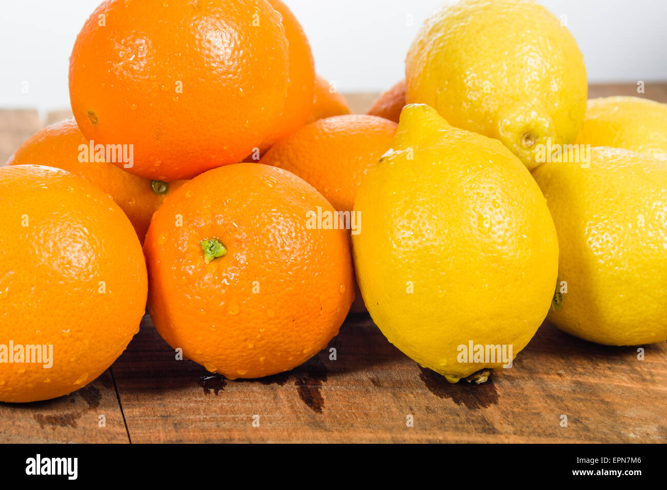Orange and lemon citrus fruit on a wooden table Stock Photo