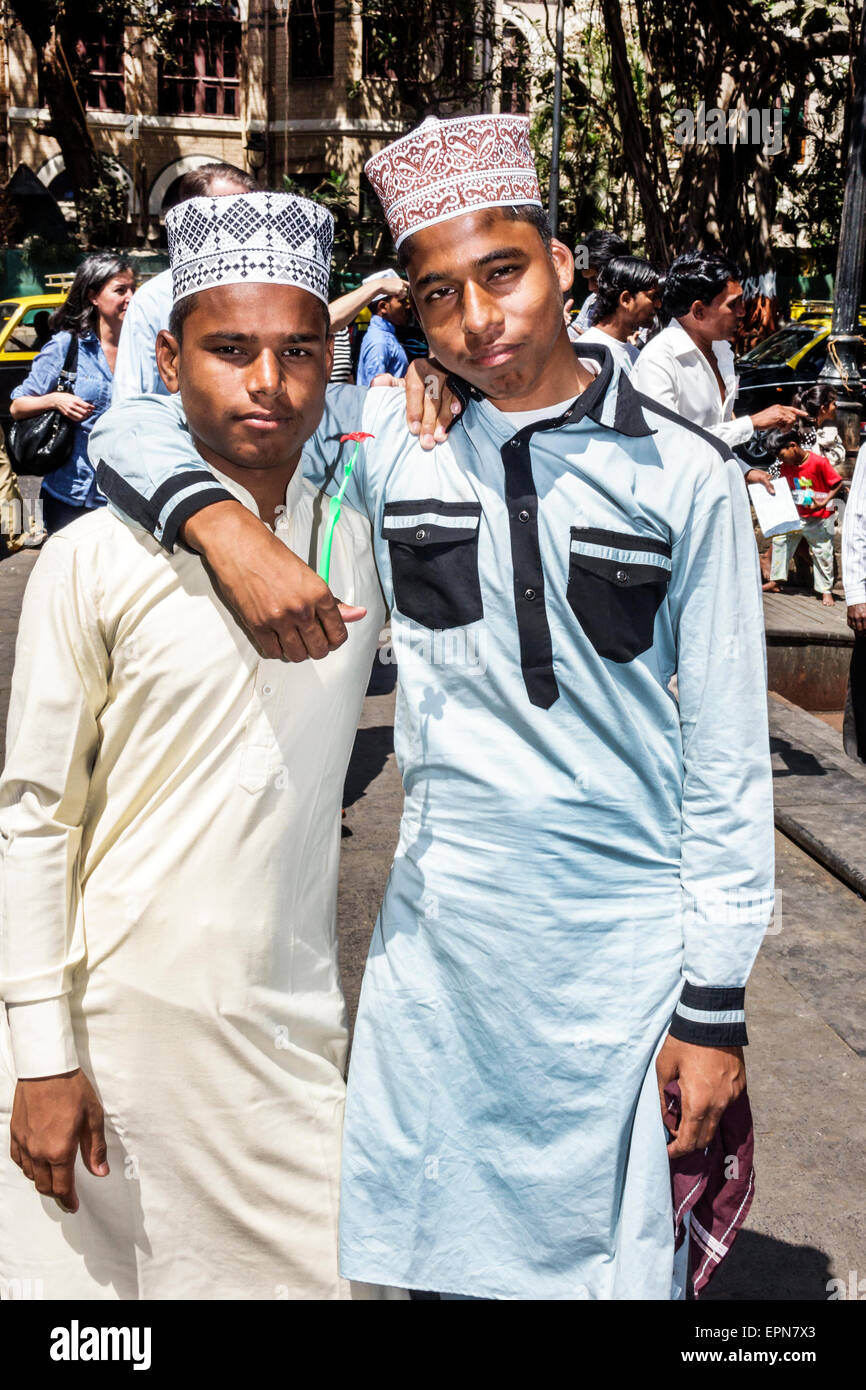 Mumbai India,Apollo Bandar,Colaba,PJ Ramchandani Marg,Road,Muslim,teen teens teenager teenagers male boy boys kids children friends,topi,taqiyah cap,r Stock Photo