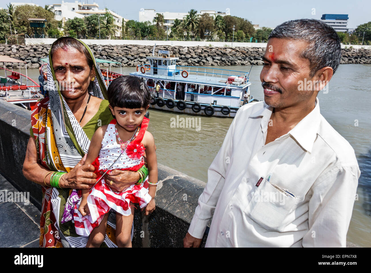 Mumbai India,Indian Asian,Apollo Bandar,Colaba,Arabian Sea water,ferry,boat,Hindu,bindi,adult adults man men male,grandfather,adult adults woman women Stock Photo