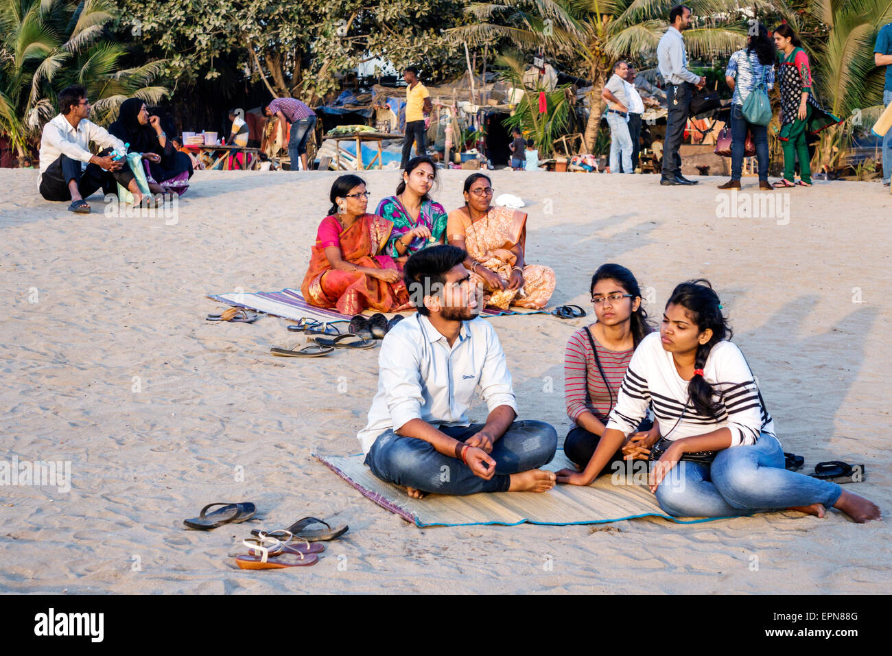 Mumbai India,Girgaon,Marine Drive,Chowpatty Beach,public,man men male,woman female women,sitting,sand,India150227203 Stock Photo