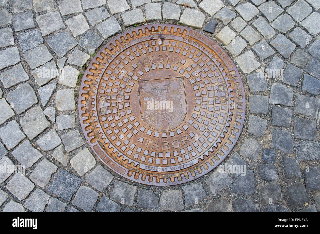 street, sewer lid on a street, the CITY of TABOR Stock Photo