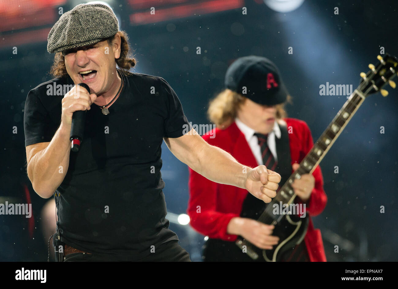 Munich, Germany. 19th May, 2015. The singer, Brian Johnson (L), and the guitarist, Angus Young, in the Australian rock band AC/DC stand on stage in the Olympic Stadium in Munich, Germany, 19 May 2015. Photo: SVEN HOPPE/dpa/Alamy Live News Stock Photo