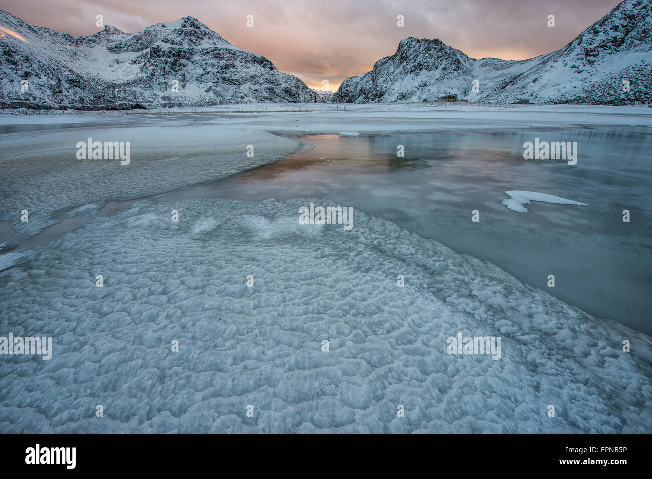 Frozen pond in the mountains, Lofoten Islands, Norway Stock Photo