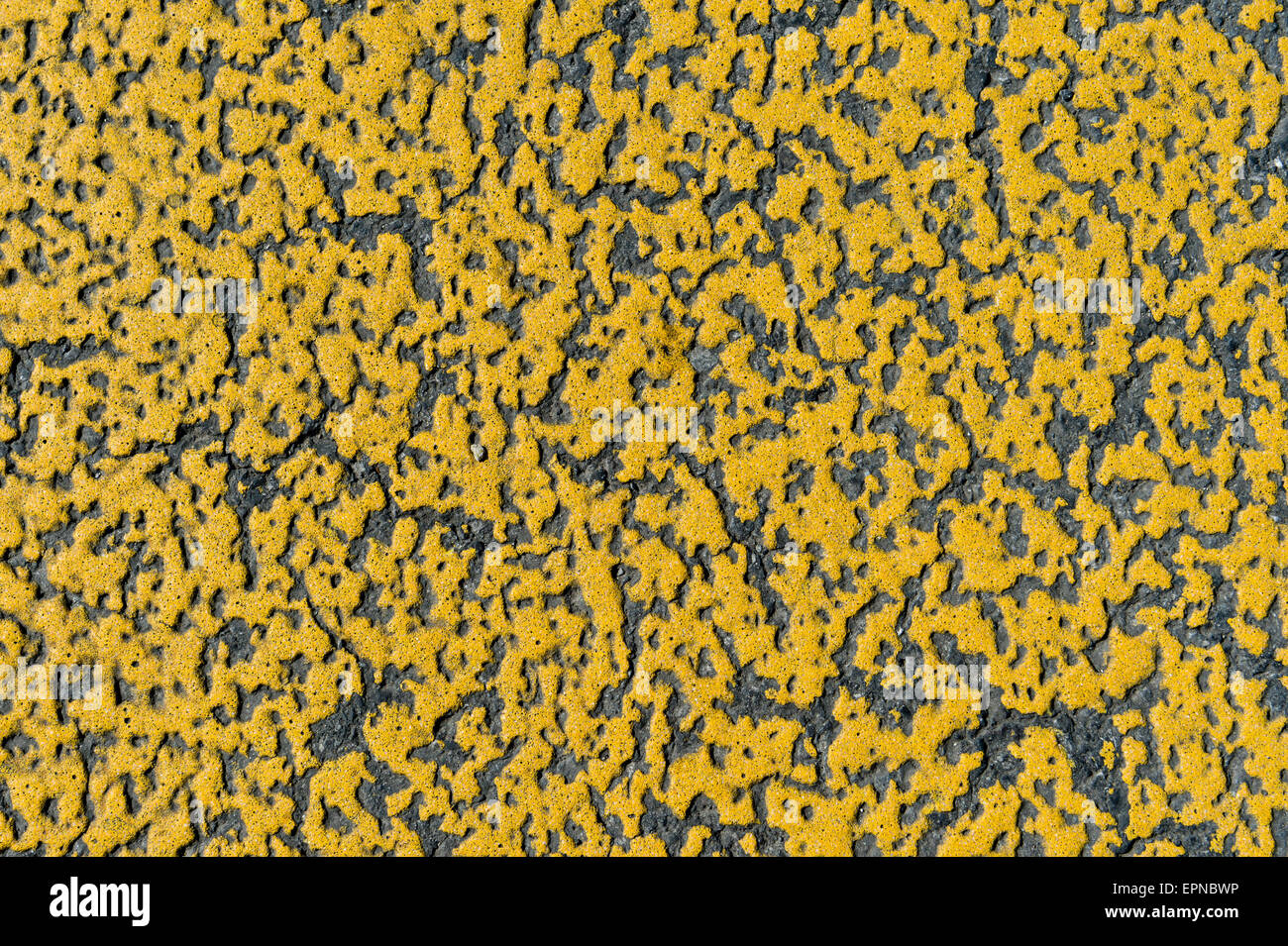 Yellow paint on asphalt, road marking details, Switzerland Stock Photo