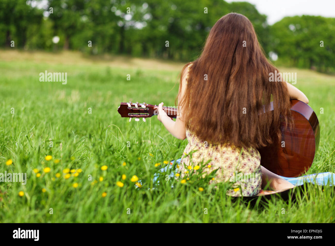 Young woman playing a guitar Stock Photo