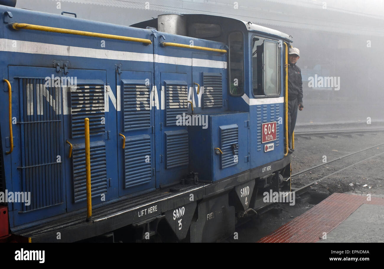 Diesel locomotive on a foggy morning at Darjeeling Railway Station. Stock Photo