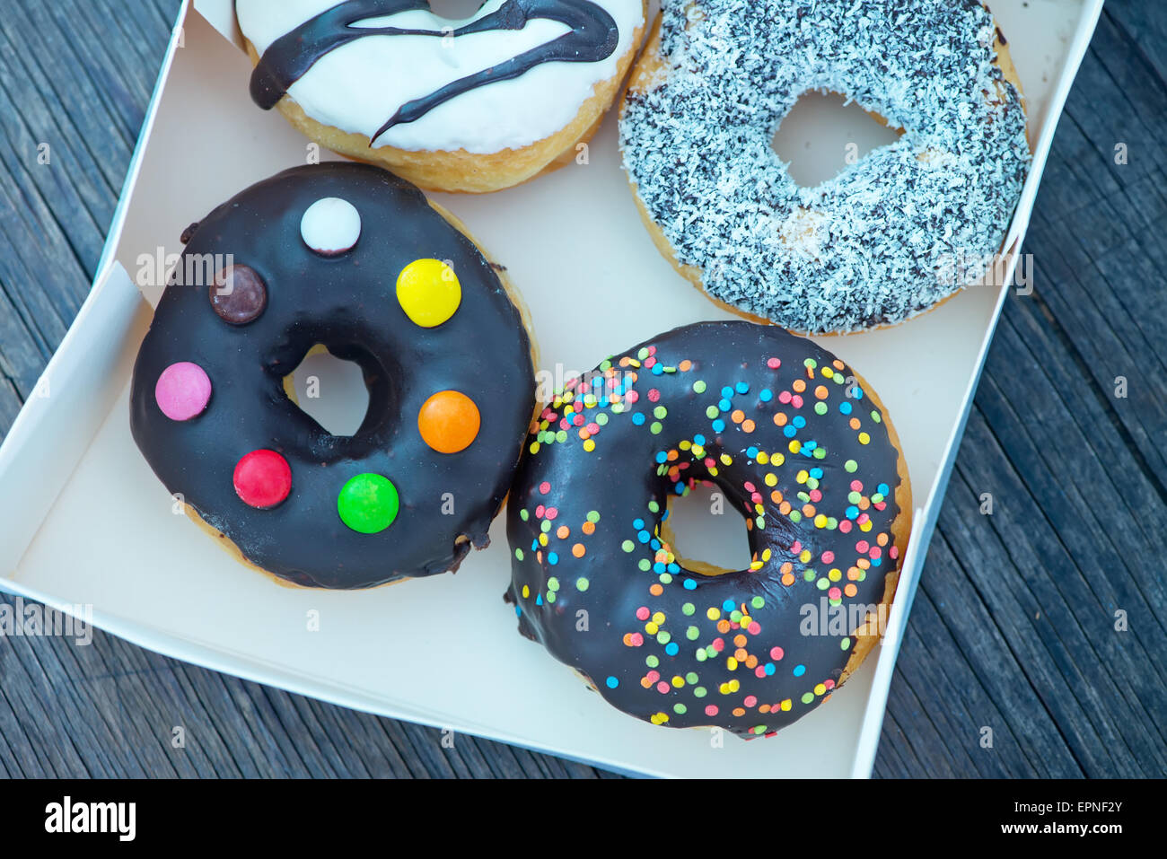 donuts in white box and on a table Stock Photo - Alamy