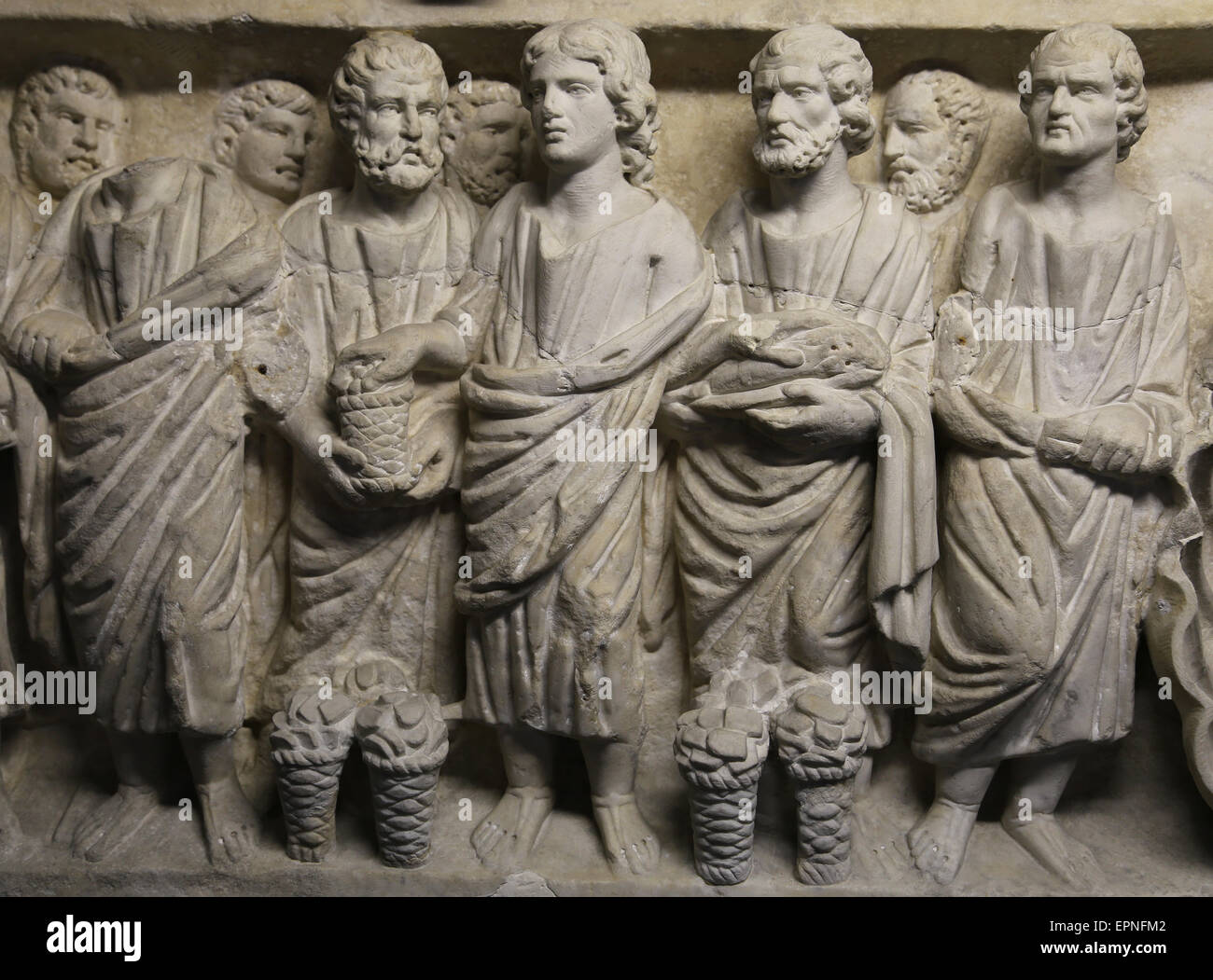 Roman art. Early Christian. Feeding the multitude. Miracles of Jesus. Relief. Sarcophagus. Vatican Museums. Stock Photo