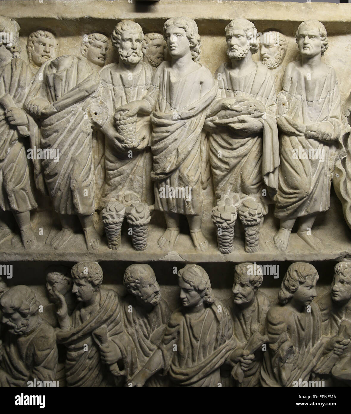 Roman art. Early Christian.  Feeding the multitude. Miracles of Jesus. Relief. Sarcophagus. Vatican Museums. Stock Photo