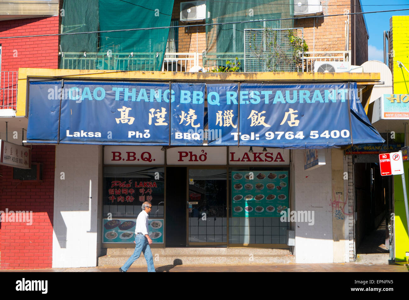 man walking past asian bbq restaurant in Flemington,suburb in western Stock  Photo - Alamy