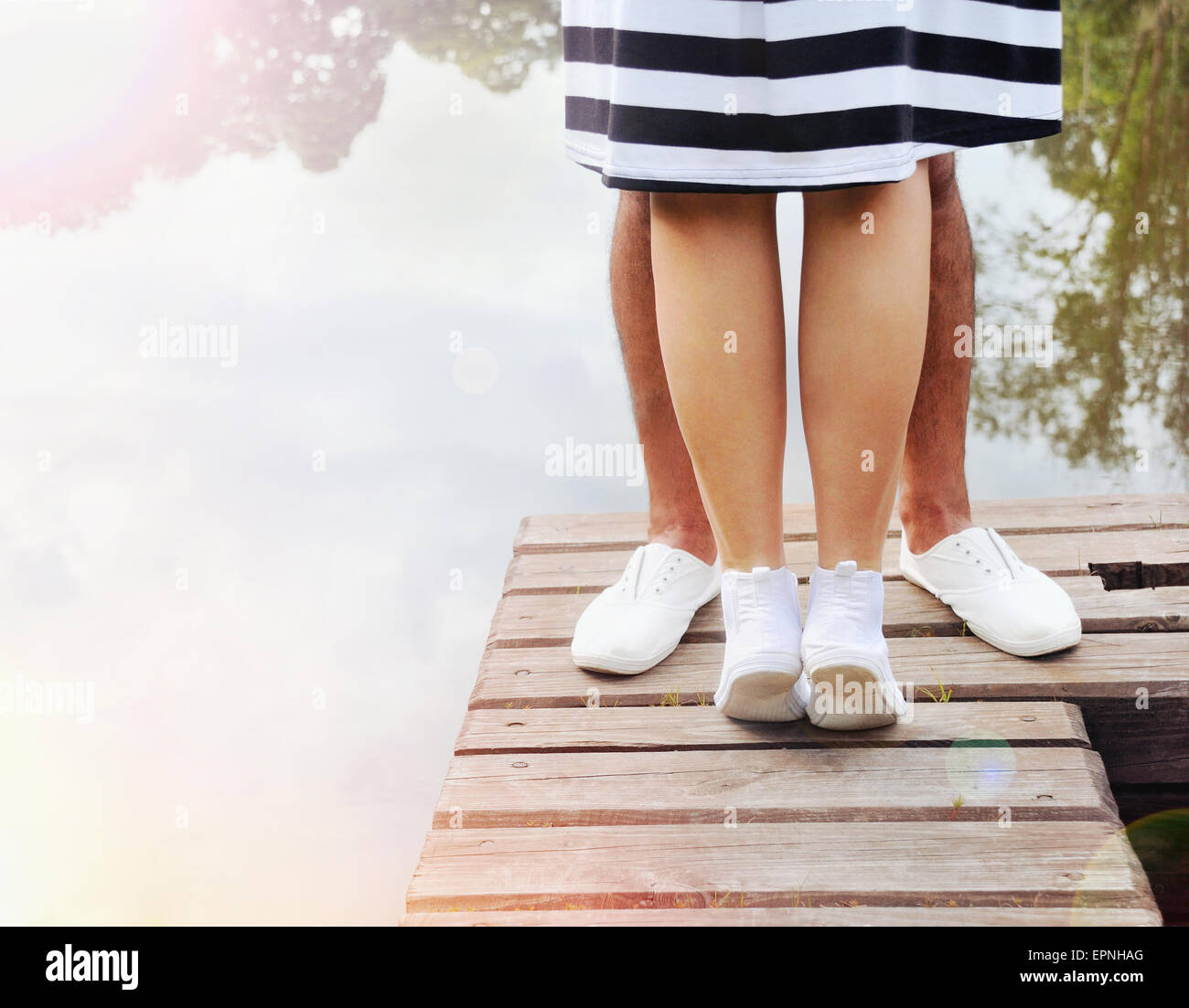 Curated visual reference: Visual Reference: Couple Kissing On The Pier Near Lake In Hot Summer
