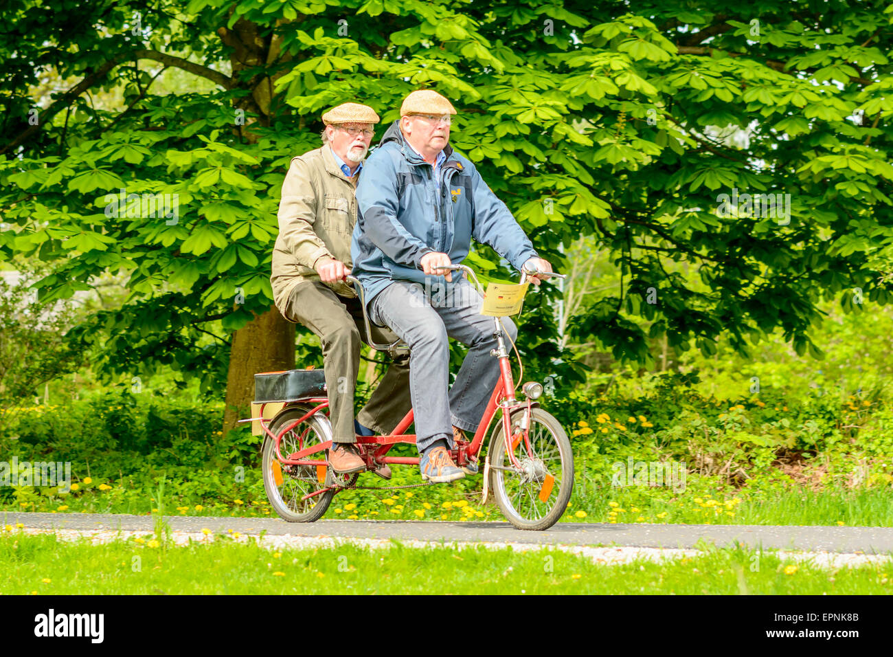 Solvesborg, Sweden - May 16, 2015: International Veteran Cycle Association (IVCA) 35th rally. Costume ride through public streets in town. Ride through park. Stock Photo