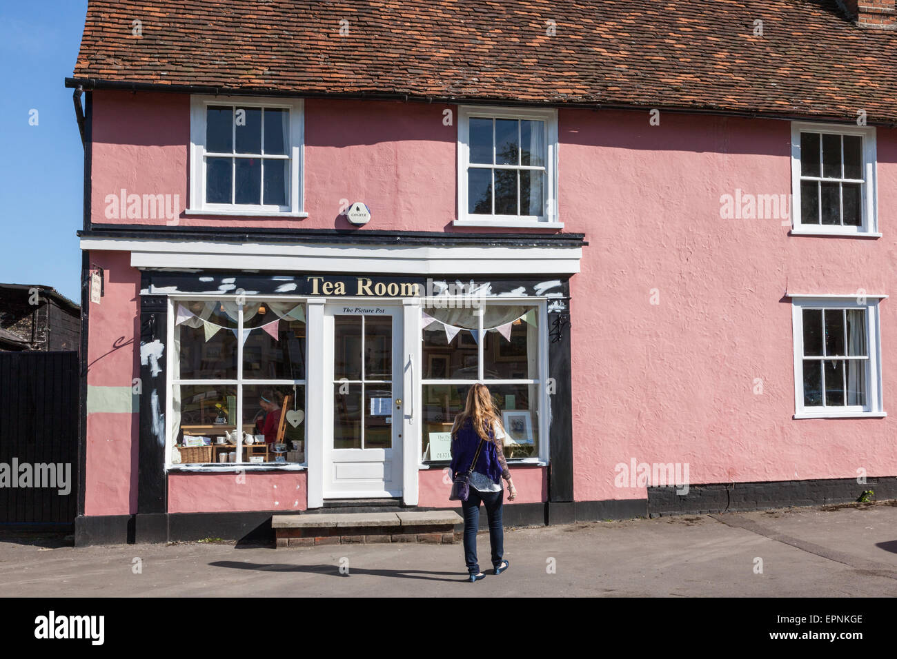 Tea rooms in a pretty cottage in Finchingfield, a small girl inside and