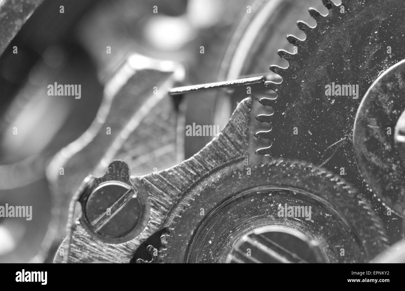 Black white Background with metal cogwheels a clockwork. Macro. Stock Photo