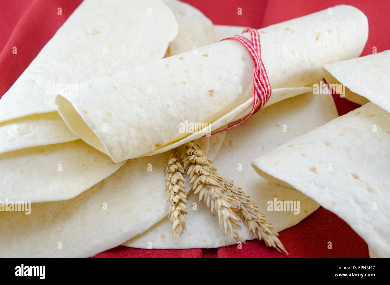 Empty tortillas tied with a ribbon on a table Stock Photo