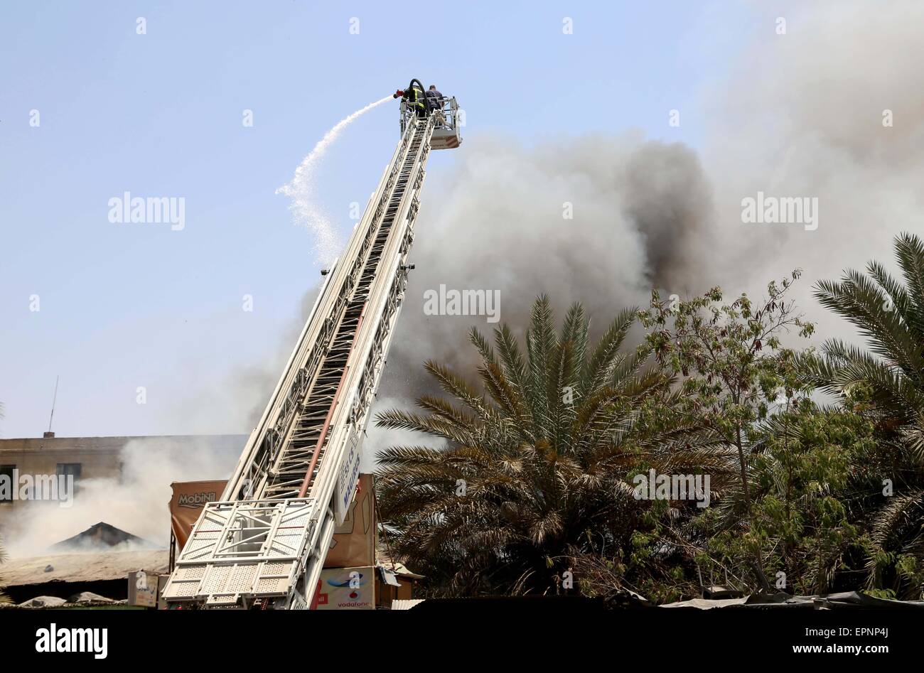 Cairo, Egypt. 20th May, 2015. Egyptian firefighters ride their vehicle