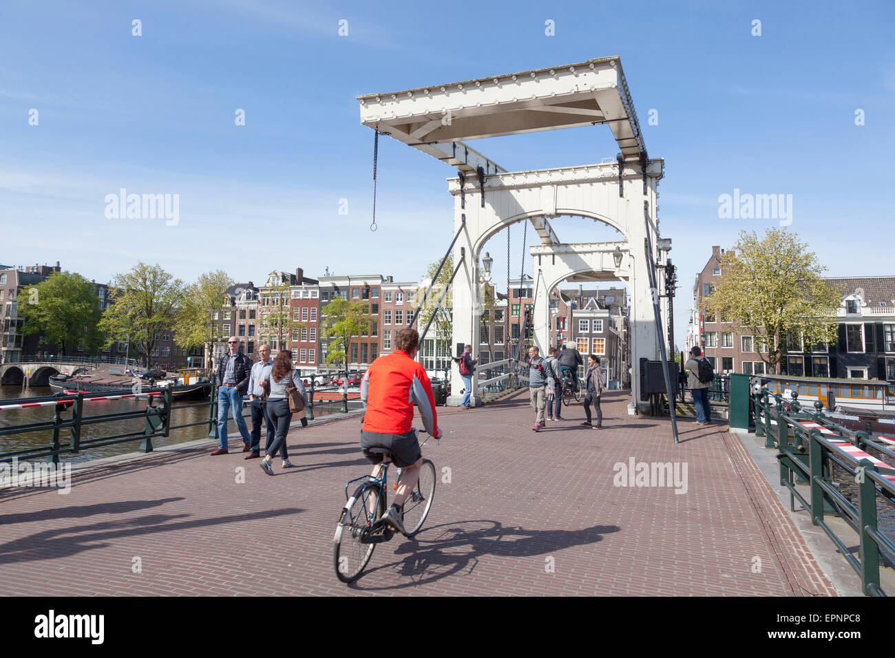 bikes on skinny bridge in amsterdam centre on sunny spring day Stock Photo