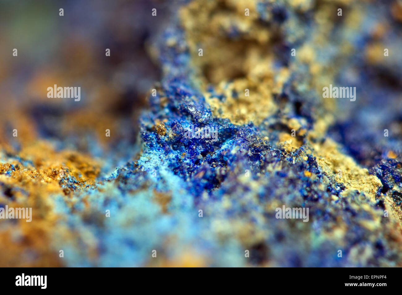 Azurite is soft, deep blue copper mineral produced by weathering of