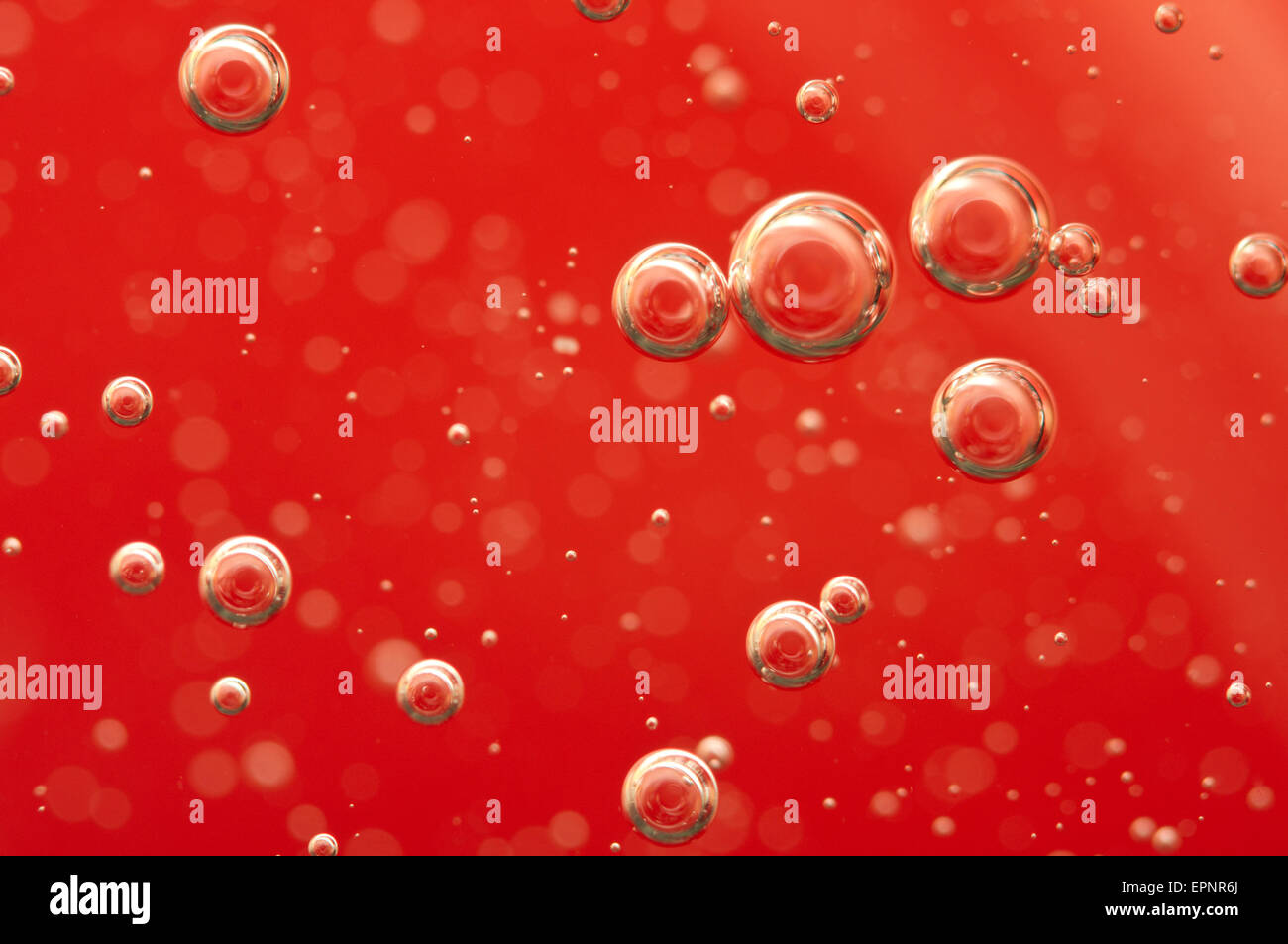 Air bubbles in a red liquid , concept such as medical research of blood