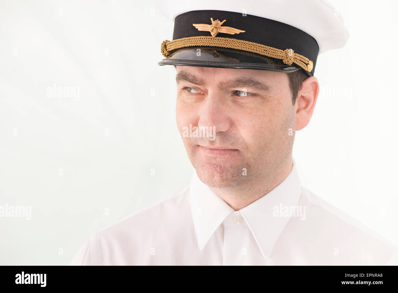 Portrait of man in pilot hat looking away. Stock Photo