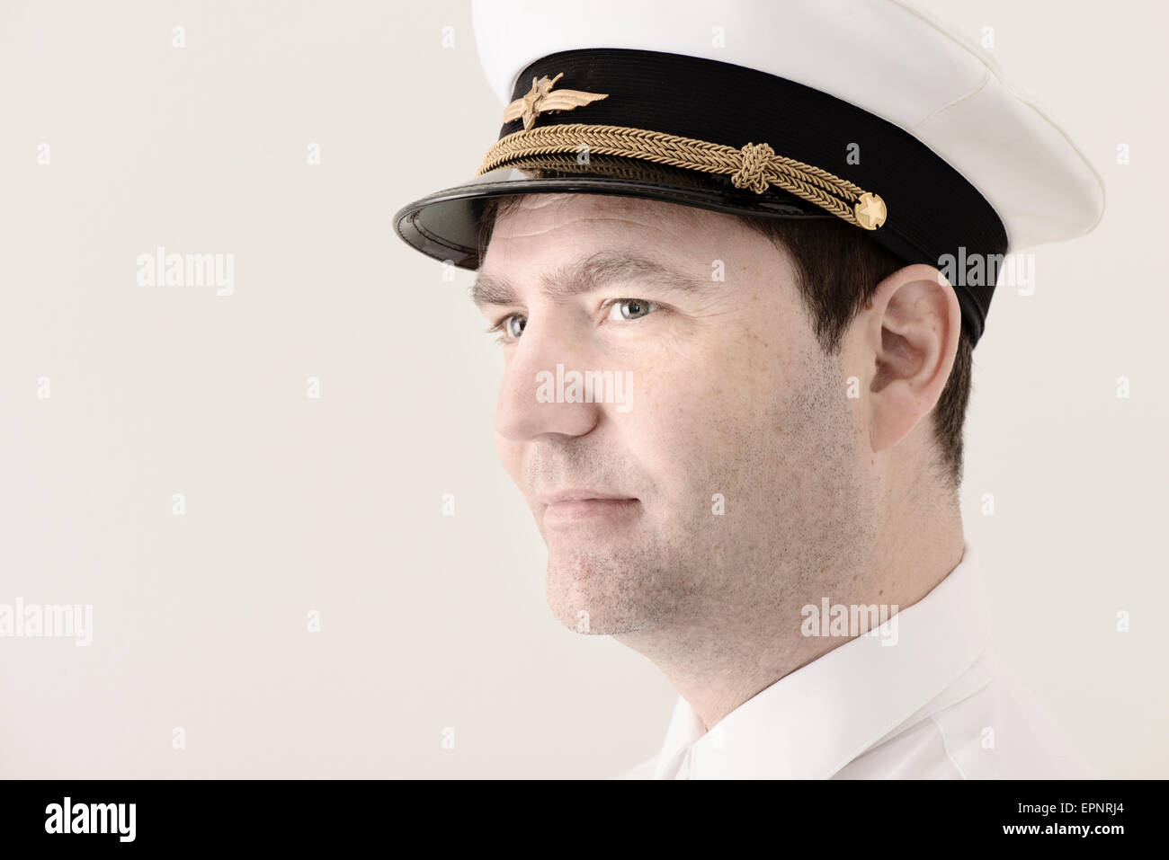 Portrait of man in pilot hat looking away. Stock Photo