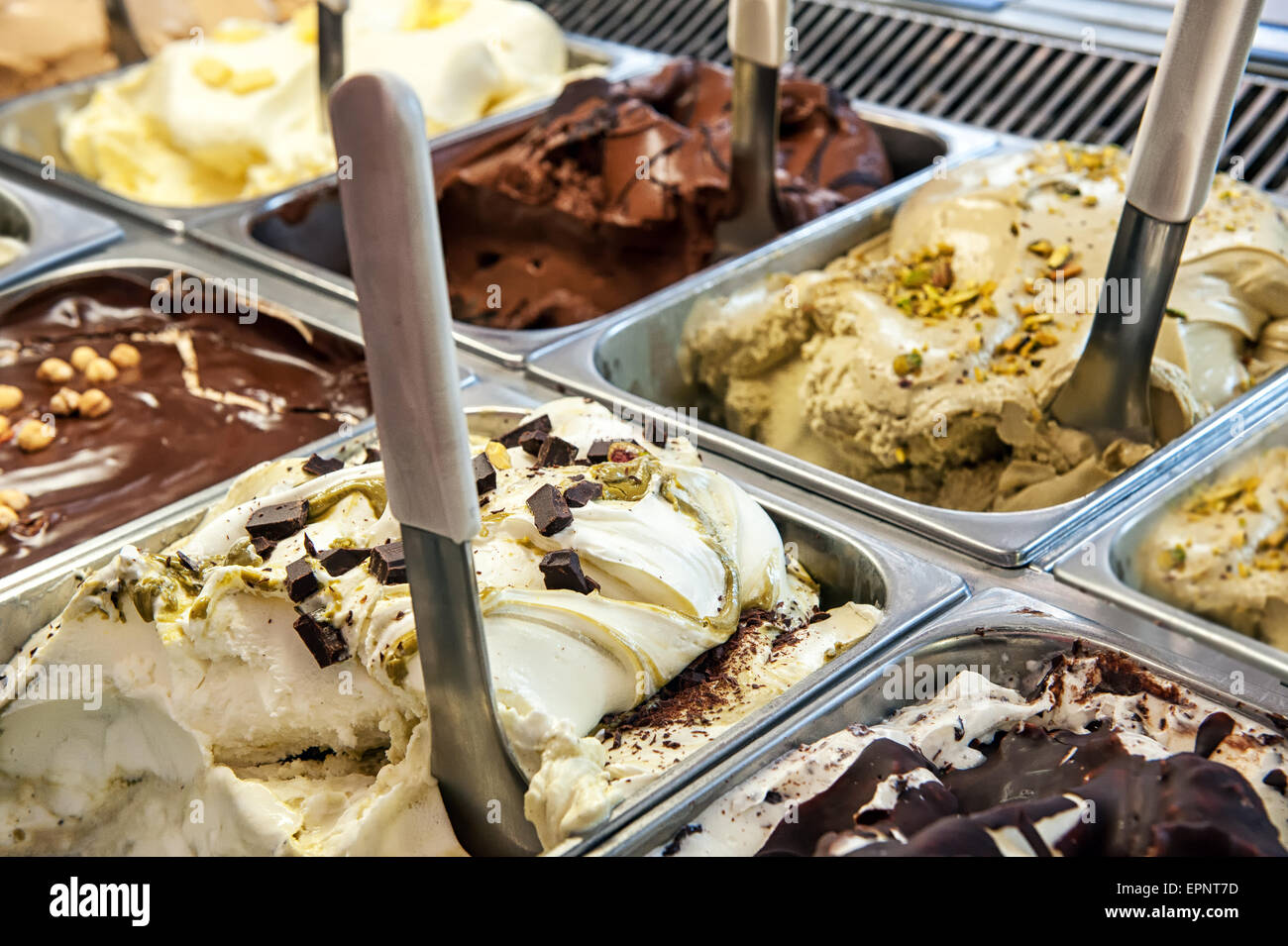 Close up of trays of different ice cream in assorted flavors displayed in a store window Stock Photo