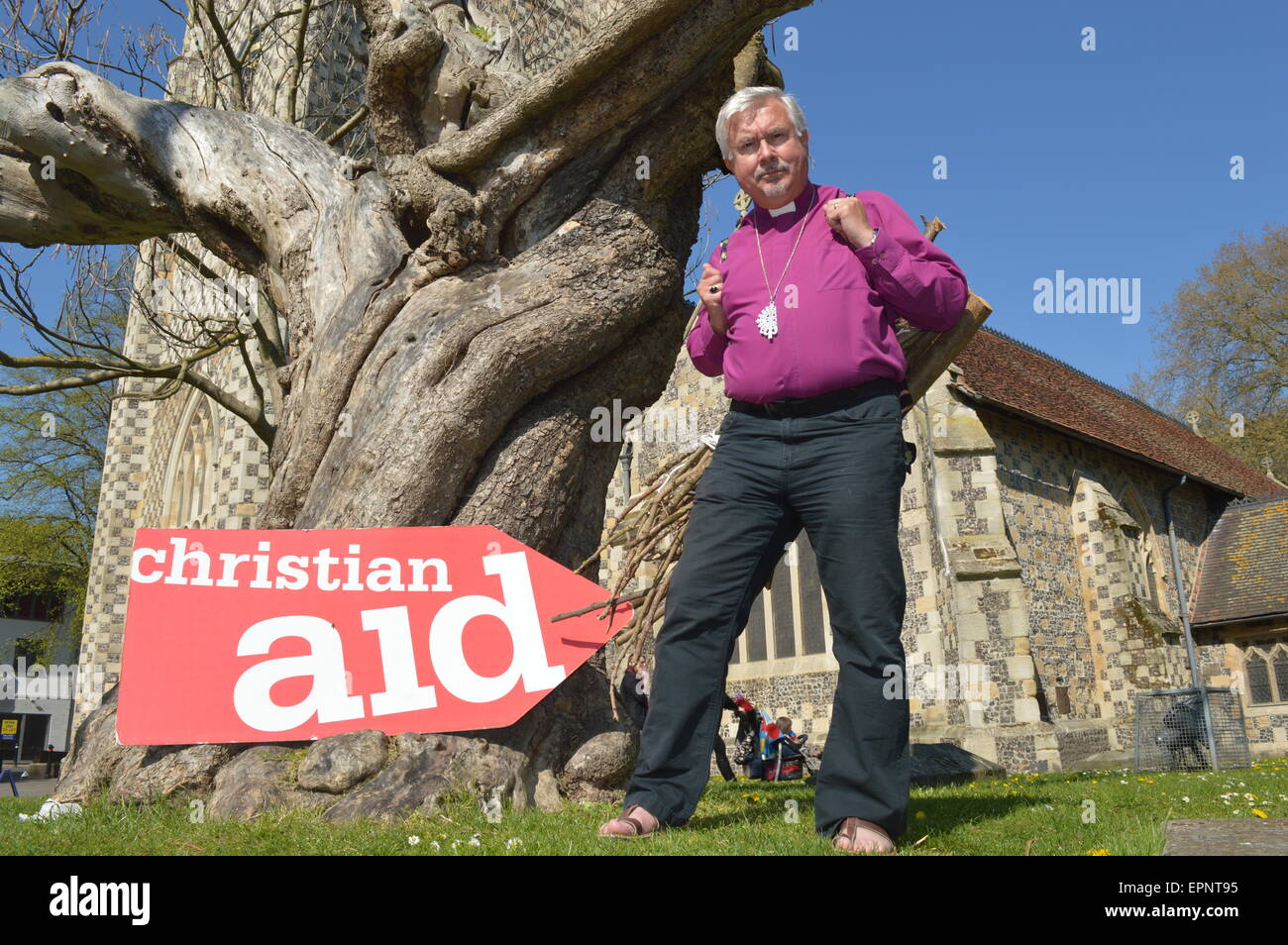 The Rt Revd Andrew Proud, Bishop of Reading carried fire wood around Reading, Berks supporting women in Africa for Christian Aid Stock Photo